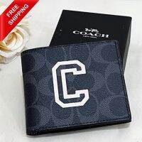 กระเป๋าสตางค์ Coach Id Billfold Wallet In Signature Canvas With Varsity Motif