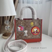 ✨ของแท้100%✨ กระเป๋าสะพาย Coach Coach X Peanuts Dempsey Tote 22 In Signature Canvas With Patches Style No. CE851