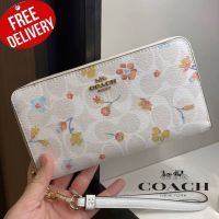 กระเป๋าสตางค์ใบยาว COACH LONG ZIP AROUND WALLET IN SIGNATURE CANVAS WITH MYSTICAL FLORAL PRINT (COACH C8695)