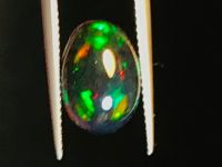 4.47cts ธรรมชาติหลากสีเล่นโอปอลสีดำ 13.6x9.3x7.5มม. 4.47cts natural multi color play black opal 13.6x9.3x7.5mm