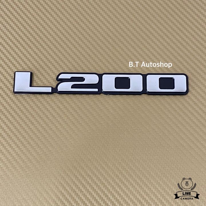 โลโก้-l-200-ติดรถ-มิตชูบิชิ-สีเงินขอบดำ-ขนาด-2-3-x-17-cm