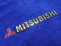 โลโก้คำว่า MITSUBISHI ขอบดำ (2.2×19cm.) ราคาต่อ 1ชิ้น