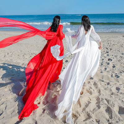 กระโปรงชายหาดทะเลสาบชิงไห่ซานย่าชุดเดรสใส่ไปริมทะเลในวันหยุดแบบนางฟ้าสุดๆเดรสยาวสีแดงแบบลากพื้นยาวใส่ในทะเลทรายเปิดหลังสำหรับถ่ายรูป