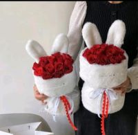 Bouquet with rose flowers with cloth with rabbit hat Free greeting card