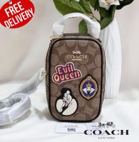 กระเป๋าสะพาย COACH Disney X Coach Eva Phone Crossbody In Signature Canvas With Patches