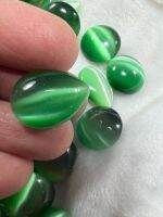 ตาแมว พลอย ตาแมว ( LAB MADE Cats Eye GREEN EMERALD COLOR ) หนัก 19 กะรัต ทรงกลม ราคา เป็น 1 เม็ด. พลอย ขนาด  18X12.50 MM มิล