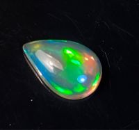 โอปอลหลากสีธรรมชาติ 0.70cts ลูกแพร์ 9x6x3mm 0.70cts natural multi color play opal 9x6x3mm pear