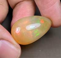 โอปอลเล่นสีธรรมชาติ 13.85cts ลูกแพร์ 22x15mm 13.85cts natural color play opal 22x15mm pear