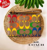 กระเป๋าสตางค์ COACH C4572 CORNER ZIP WRISTLET IN RAINBOW SIGNATURE CANVAS (IMMU4)