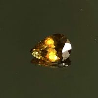 andalusite 0.63 cts, 6.4x4.3x3.3 mm, pear shape 100% natural gemstone.   อันดาลูไซต์ 0.63 กะรัต, 6.4x4.3x3.3 มม. รูปทรงลูกแพร์ พลอยธรรมชาติ 100%