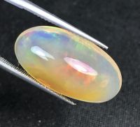 โอปอลเล่นสีธรรมชาติเอธิโอเปีย 14.6cts 23x13.5x9mm 14.6cts natural ethiopian color play opal 23x13.5x9mm