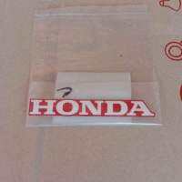 สติ๊กเกอร์แท้ HONDA สีขาวพื้นแดง ติดบังลมเวฟ125รุ่นไฟเลี้ยวบังลม,1ชิ้น(87130-KTM-730ZG)