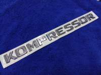 โลโก้คำว่า KOMPRESSOR สีชุปโครเมี่ยม ( SIZE 2×24cm) ราคาต่อ 1ชิ้น