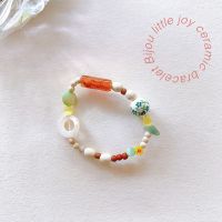 (พร้อมส่ง) Bijou little joy ceramic bracelet กำไลไหมยืด หินนำโชค