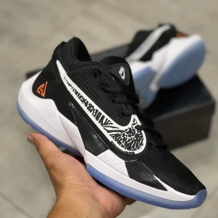 white basketball shoes with black socks