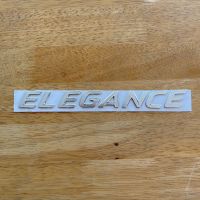 โลโก้ ELEGANCE ตัวหนังสือฝาท้าย