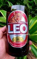 แก้วตัดจากขวด LEO ติดสติ๊กเกอร์กันน้ำให้เรียบร้อย