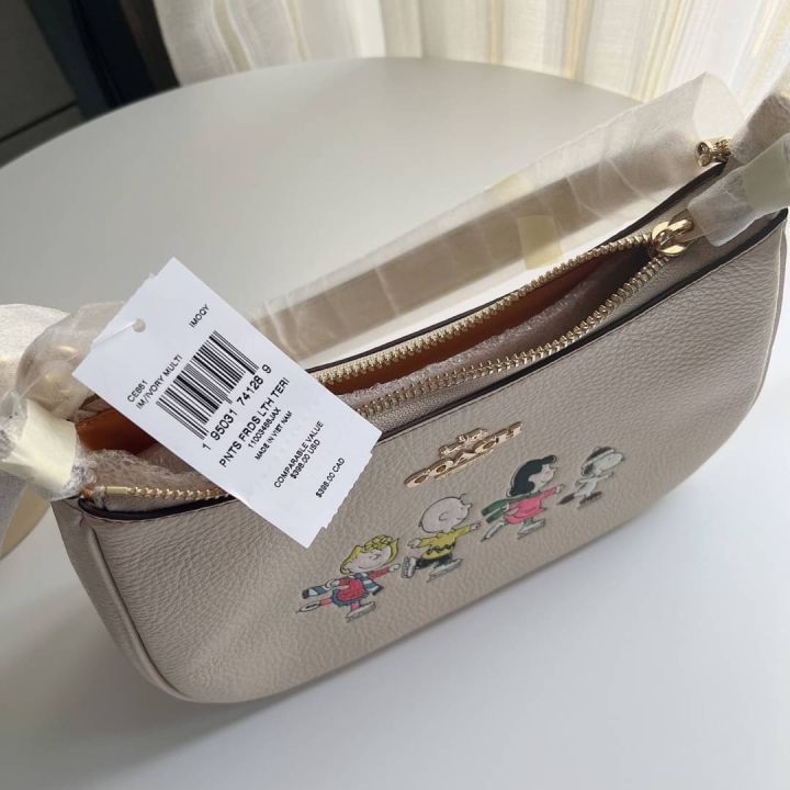 ของแท้100-กระเป๋าสะพาย-coach-x-peanuts-teri-shoulder-bag-with-snoopy-and-friends-motif-coach-ce861