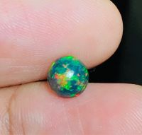 โอปอลธรรมชาติหลากสี 0.62 กะรัต กลม 6 มม 0.62cts natural multi color play opal 6mm round