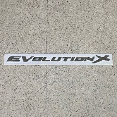 โลโก้* EVOLUTICN-X ติดฝากระโปรงหน้า มิตชูบิชิ ขนาด 2 x 36.5 cm ตัวอักษรแยก สีเงินชุบโครเมี่ยม