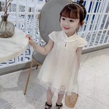 Chinese Young Girl Wearing A Stylish White Dress Shopping In The