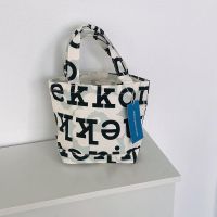 Marimekko pieni ahkera unikko logo