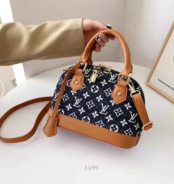 LV LOCK HANDBAG SLING BAG