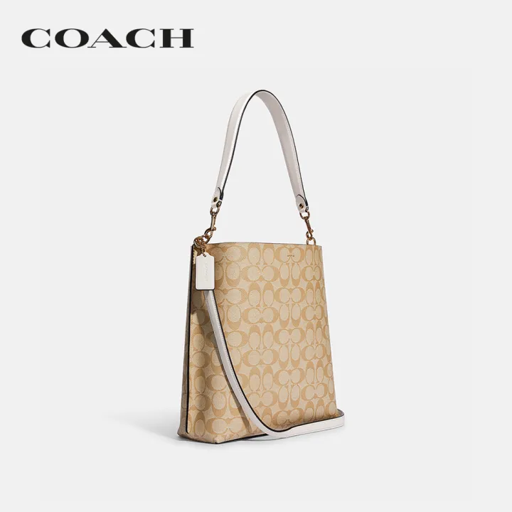 coach-กระเป๋าสะพายไหล่ผู้หญิงรุ่น-mollie-bucket-bag-in-signature-canvas-สีครีม-ca561-imdqc