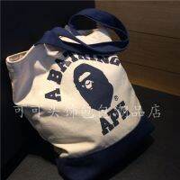 จุด BAPE กระเป๋าผ้าใบอาบน้ำลิงหัวกระเป๋านักเรียนกระเป๋าช้อปปิ้งสีเขียวกระเป๋าสะพายไหล่แบบพกพา