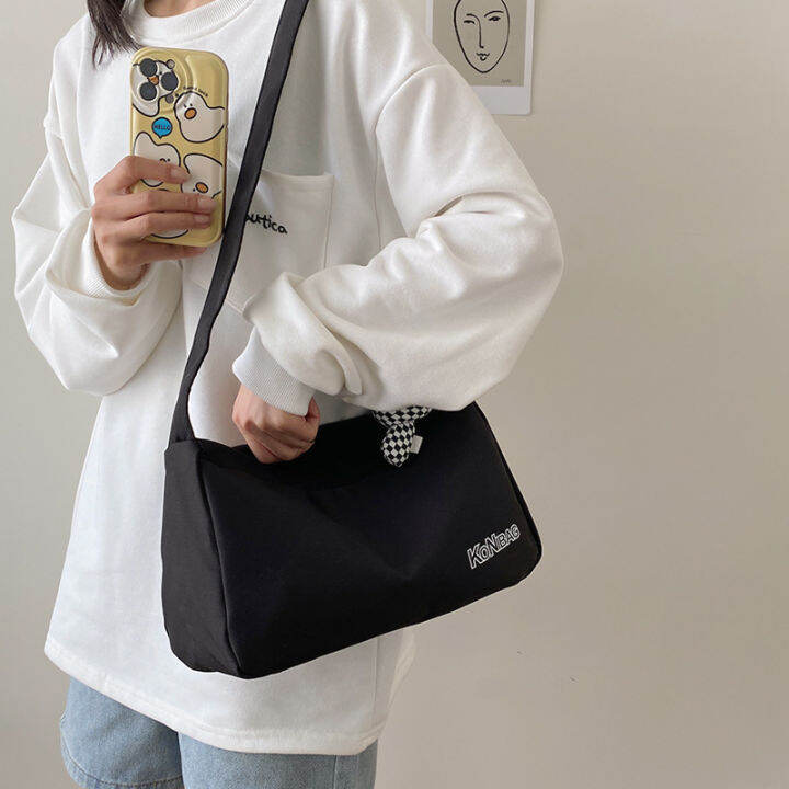 koreafashionshop-kr1851-กระเป๋าสะพายข้างkonbag-ผ้าอ๊อกซ์ฟอร์ด-แถมที่ห้อย