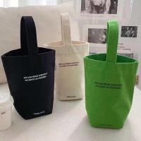2023 new minimalist style mini portable canvas bag lunch bag candy color kettle wrist strap plain canvas bag Toiletries  Cosmetics Bags