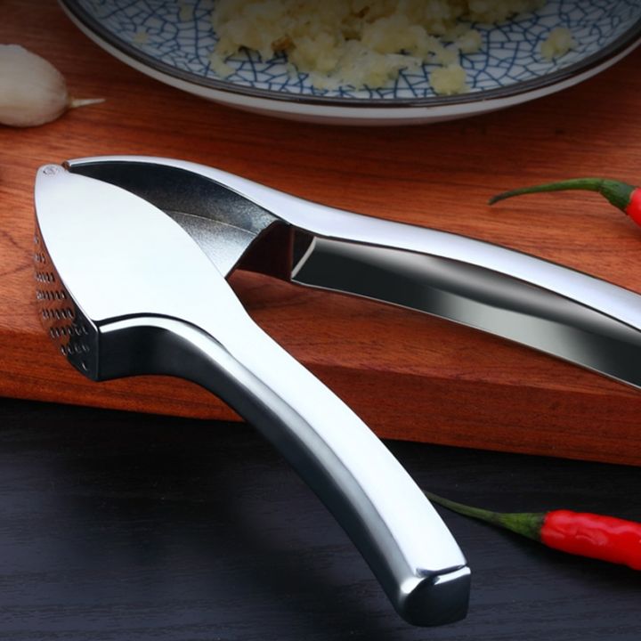 garlic-press-crusher-and-mincer-with-sturdy-construction-professional-food-grade-rust-proof-easy-squeeze-and-clean