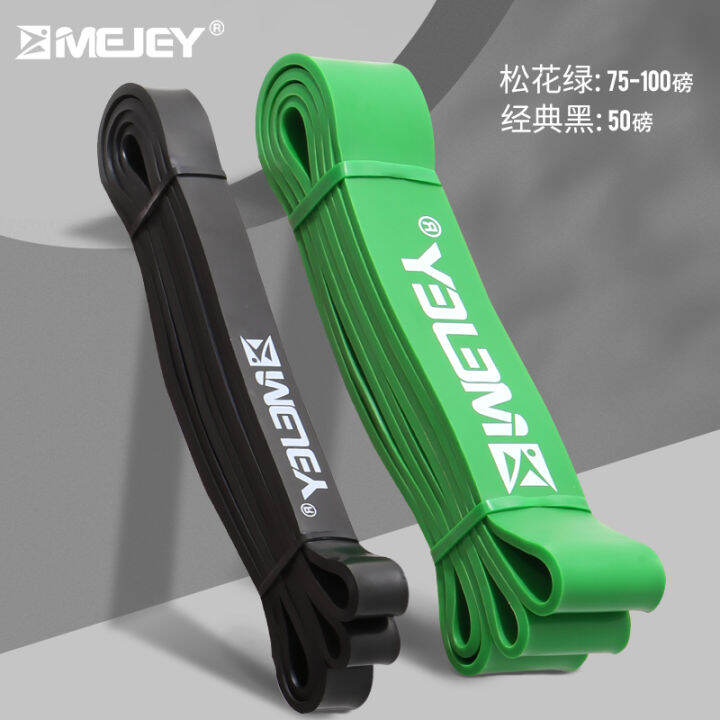 Elastic band fitness men and women practicing chest buttocks resistance