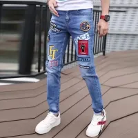 Celana Jeans Denim ลำลองสไตล์เกาหลีสำหรับผู้ชายเสื้อผ้าแนวสตรีทพิมพ์ลายกราฟฟิตีกางเกงแบบฮิปฮอปหรูหราแฟชั่นแนวสตรีทพิมพ์ลายยืดรัดรูป