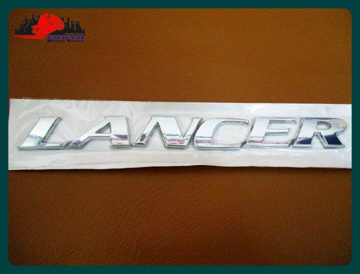 mitsubishi-logo-lancer-plate-sticker-chrome-size-18x2-cm-1-set-โลโก้-lancer-ติด-mitsubishi-ขนาด-18x2-ซม-พร้อมกาวติด