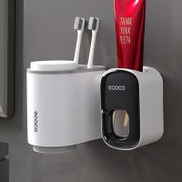 Ecoco ที่ใส่แปรงสีฟันชุดที่วางถ้วยในห้องน้ำพร้อมที่ใส่ถ้วยยาสีฟันชั้นเก็บที่จัดระเบียบแปรงสีฟันเครื่องจ่ายสำหรับห้องน้ำ