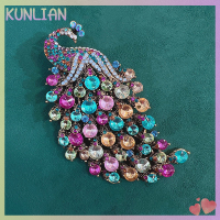 [KUNLIAN] Rhinestones นกยูงเข็มกลัดสำหรับเสื้อผ้าหรูของผู้หญิงอุปกรณ์เสริมสำหรับจัดงานแต่งงานเครื่องประดับเครื่องประดับหญิงขา