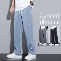 Lyocell ผ้านิ่มสำหรับผู้ชายกางเกงยีนส์กางเกงหลวมทรงตรงบางเอวยืดหยุ่นสายรูด M-5XL ลำลองสไตล์เกาหลี