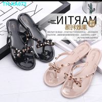 The new rivet bowknot flip-flops summer tangerine female cool out beach slippers jelly plastic shoes