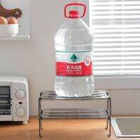 Refrigerator storage rack with heightened layered partitions inside the kitchen countertop for leftovers bowls and plates storage artifact