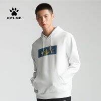 KELME Kelme เสื้อกีฬาเสื้อกันหนาวลำลองใหม่ฤดูใบไม้ผลิและในฤดูใบไม้ร่วงผู้ชายแบบสวมหัวรุ่นพื้นฐานเสื้อแจ็คเก็ตมีฮู้ดผ้าฝ้ายพิมพ์ลาย