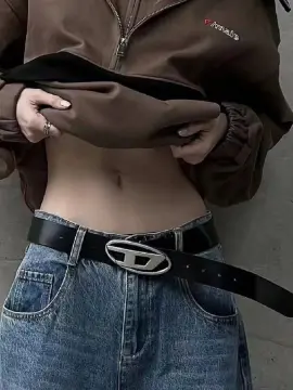 Girl wearing jeans with on sale belt