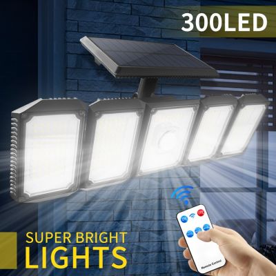 300 LEDs พลังงานแสงอาทิตย์ไฟสวนกลางแจ้งไฟ LED Motion Sensor โคมไฟติดผนังกันน้ำที่มีประสิทธิภาพสปอตไลพลังงานแสงอาทิตย์ปรับ