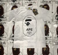 แบรนด์ BapeFashion เสื้อยืดแขนสั้นพิมพ์ลายขนาดใหญ่ผ้าฝ้ายบริสุทธิ์รอบคอหลวมแขนสั้นเสื้อยาวปิดถึงก้น