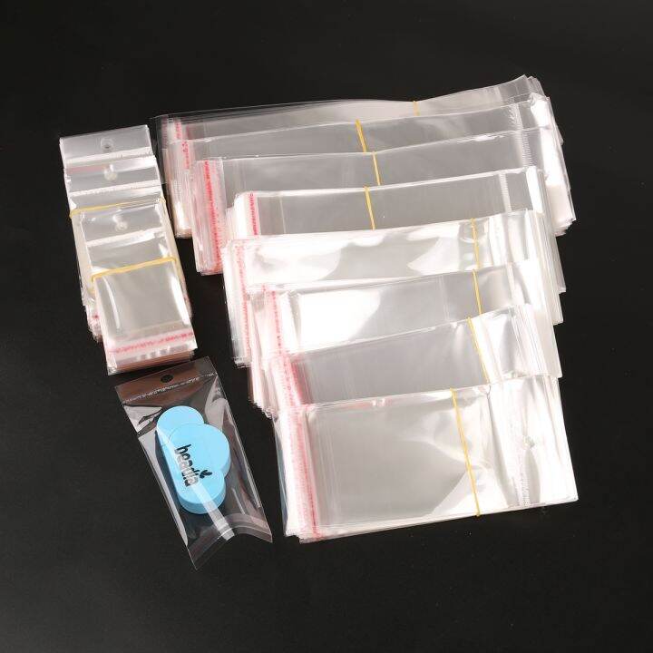 yf-100pcs-transparent-adhesive-opp-plastic-cellophane-gifts-bag-pouch-jewelry-with-hole