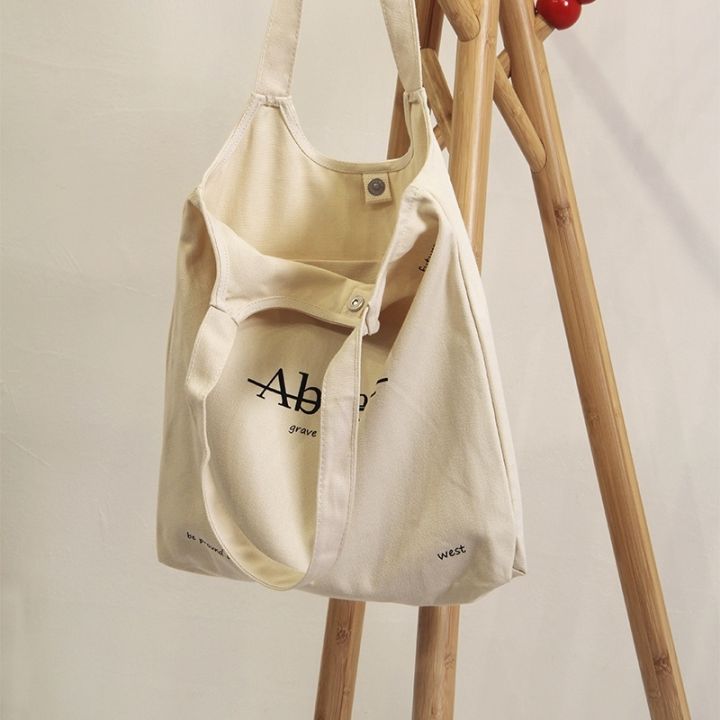 single-shoulder-canvas-bag-female-2023-new-ins-korean-style-white-japanese-students-class-joker-large-capacity-handbag