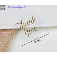 สติ๊กเกอร์​ สติ๊กเกอ​ร์ติด​กล่องขนม​ หรืออื่นๆ ลาย Thank you แบบใส ตัวหนังสือทอง 6 ดวง/แผ่น