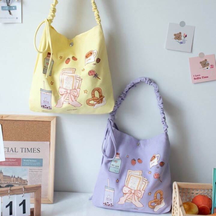 koreafashionshop-kr1781-กระเป๋าผ้าแคนวาสสะพายข้าง-สายสะพายแบบรูด-ลายการ์ตูนน่ารัก