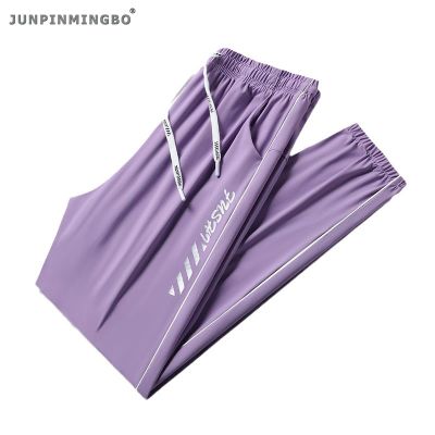 JUNPINMINGBO กางเกงลำลองผ้าไอซ์ซิลค์กันน้ำสำหรับใส่วิ่งแห้งเร็ว S-6XL กางเกงวอร์มพิมพ์ลายสไตล์คู่รัก