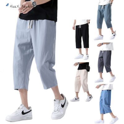 กางเกงลำลองในฤดูร้อนแบบแฟชั่น HuaX สำหรับผู้ชายผ้าฝ้ายลินินแบบหลวมสีล้วนระบายอากาศกางเกงผู้ชายขาสามส่วน